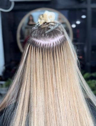 A close-up shot of ICE hair extension nano-bonds, showing their quality