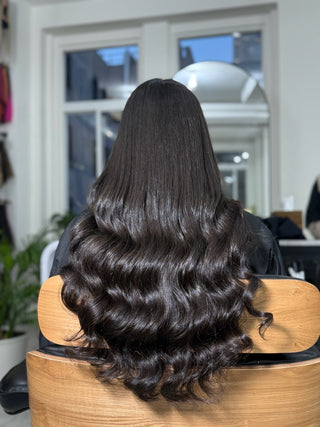 A palette of different hair extension shades showing variety.